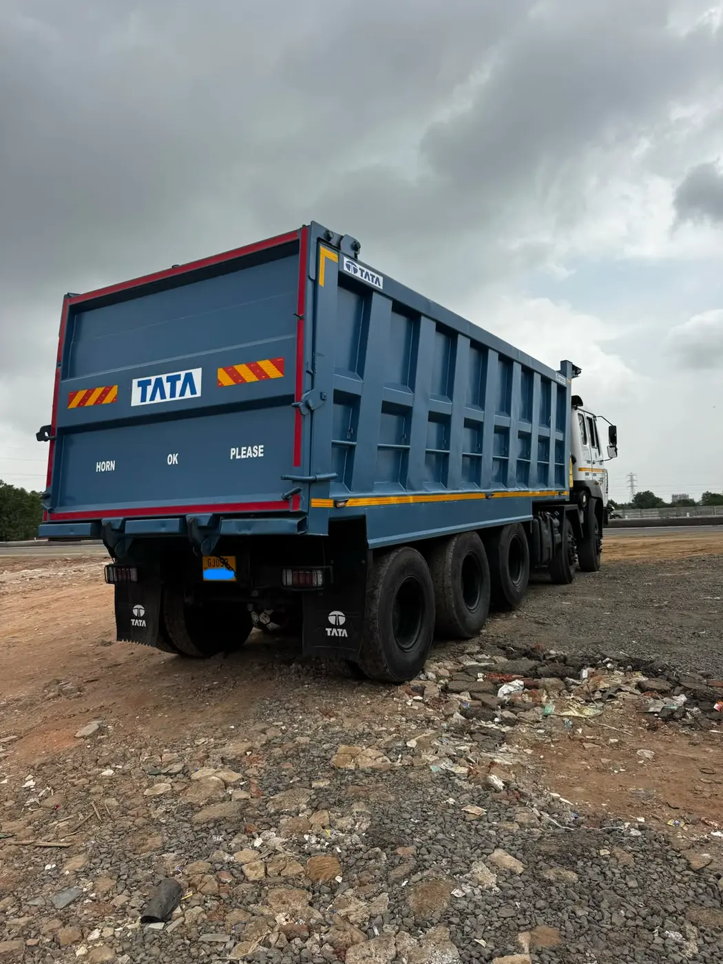 Meera Logistics blue dumper truck for construction material